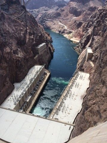 Discharge of Hoover Dam and Turbine Houses for Arizona Side (at bottom left) and Nevada Side (at bottom right) with Colorado River Flowing Down Canyon