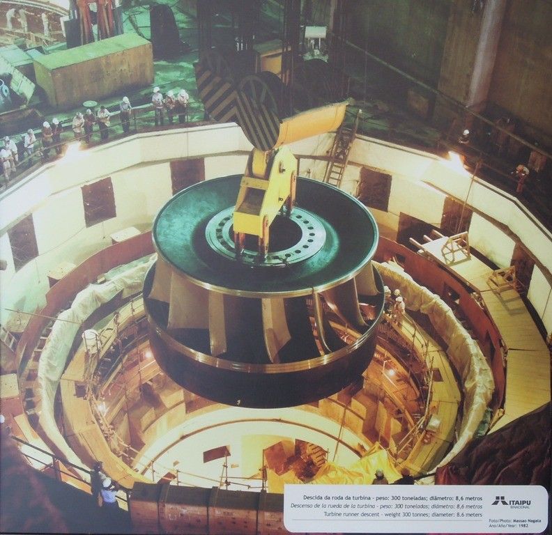 My photo of a large wall picture on display at Itaipu Dam showing when they installed one of the 8.6 meter (28 ft) diameter Francis turbines in 1982
