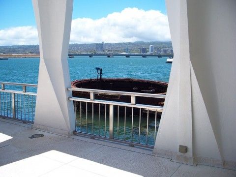 A view of part of the sunken USS Arizona from the memorial structure at Pearl Harbor